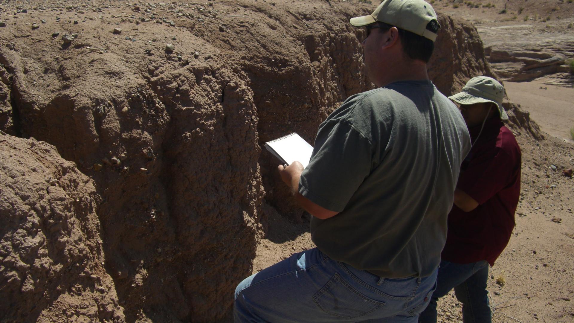 two people viewing soil 