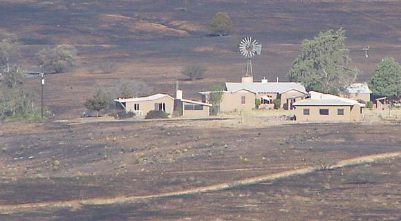 Ranch completely surrounded by burned land