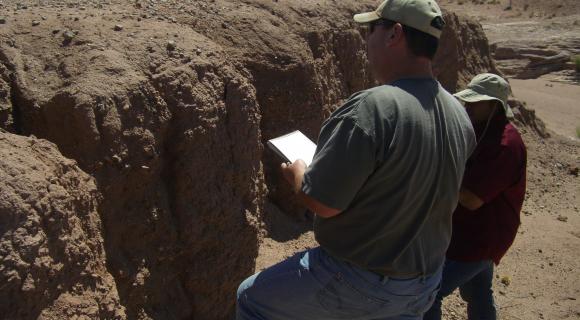 two people viewing soil 